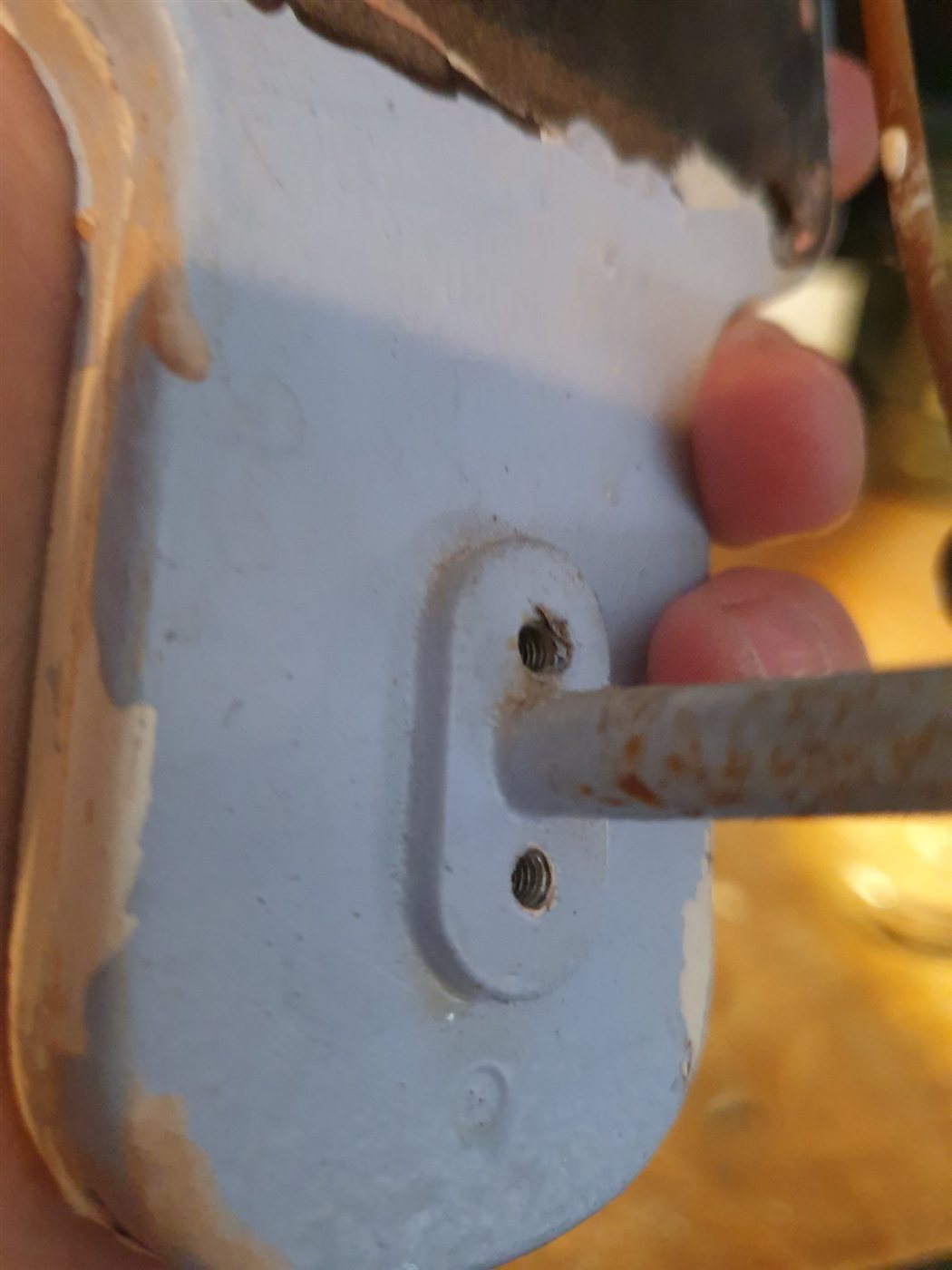Paint and rust on the bell's mounting plate and striker arm