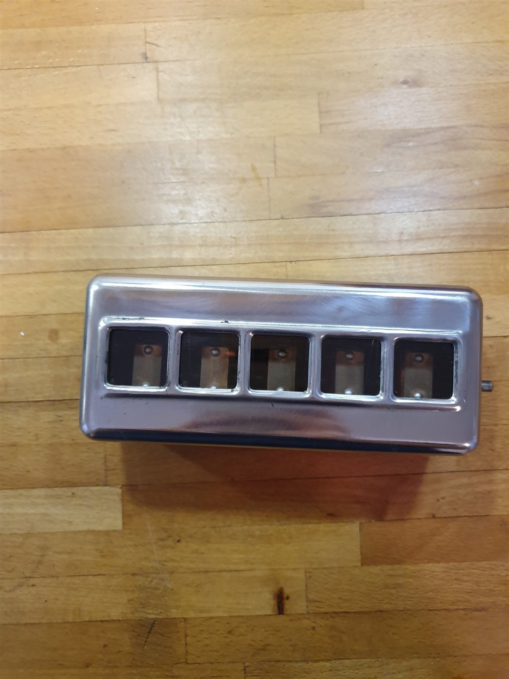 An indicator cover with the paint removed