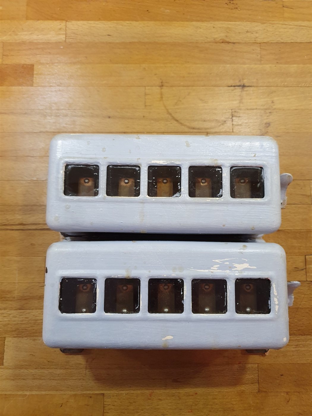 Two of the indicator boxes as found, painted over in pale blue