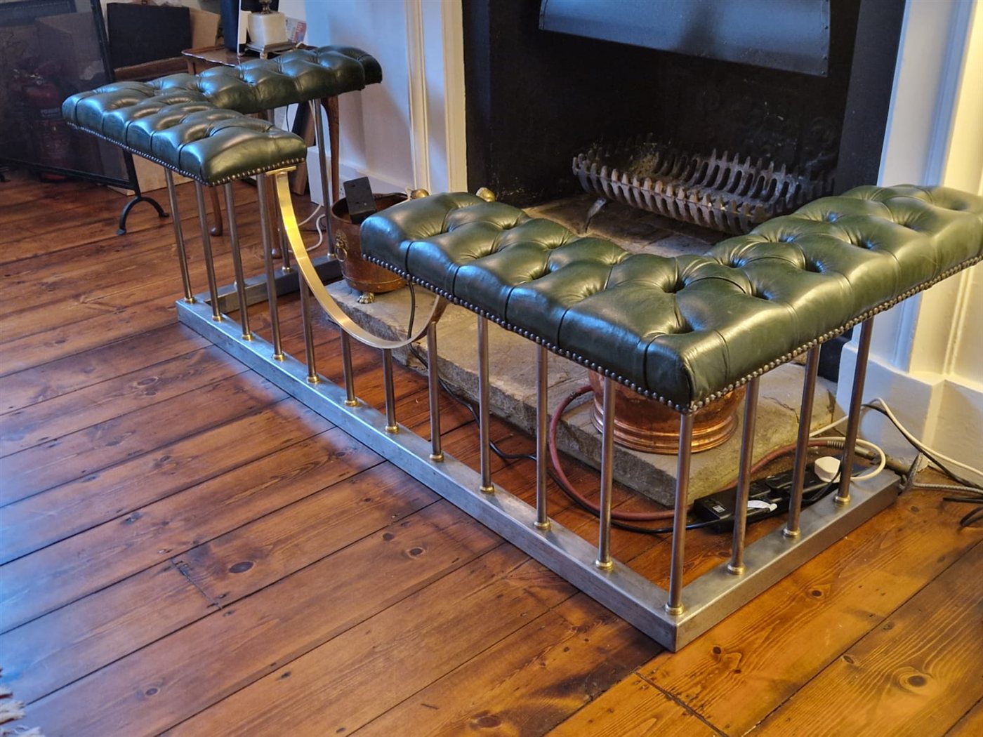 The finished fender from the side, showing the polished base and uprights