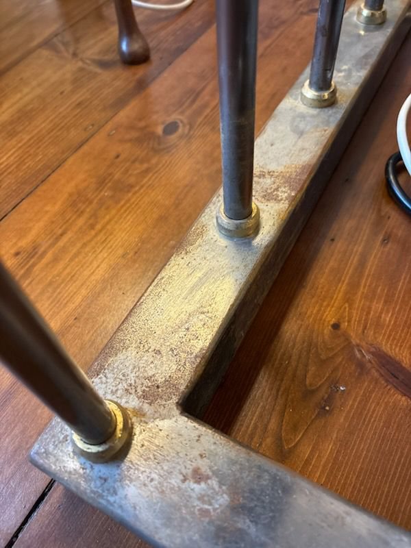 Surface rust along the length of the base