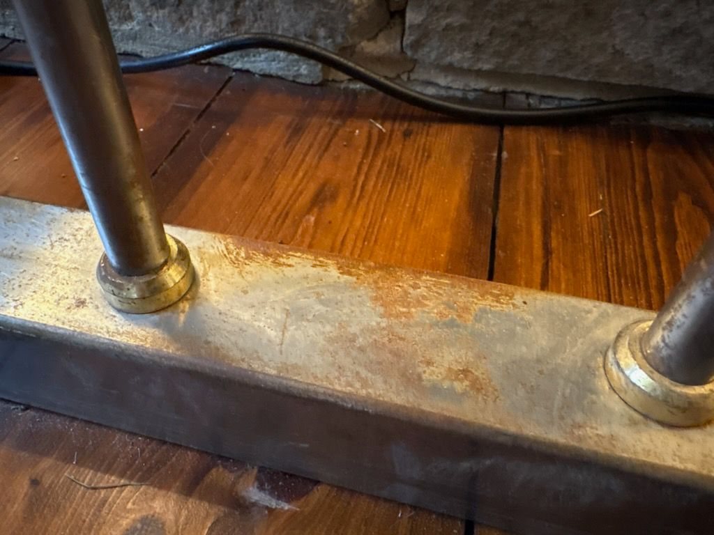 Close-up of surface rust between two uprights