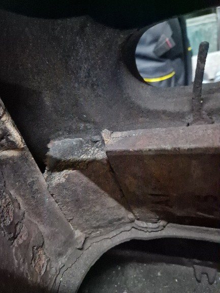 Ash cleared from behind the firebrick