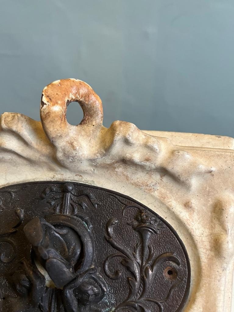 Rust staining and worn enamel on the top ornament
