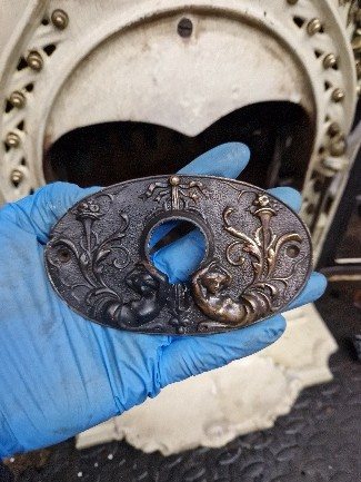 The brass escutcheon after polishing