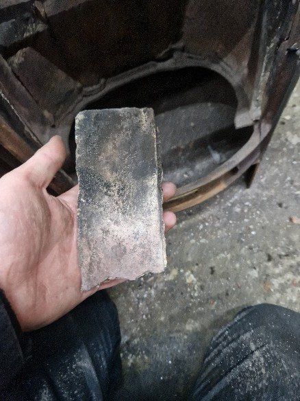 The damaged firebrick removed from the firebox