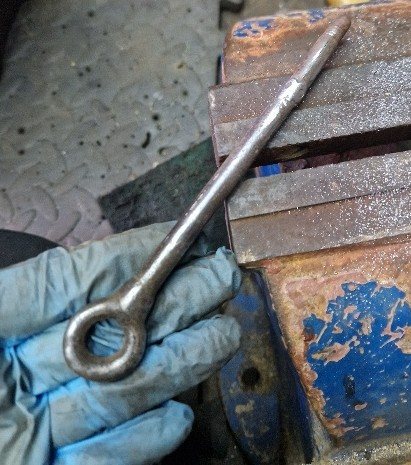 The repaired fire basket handle