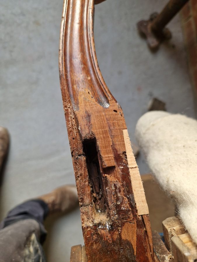 A rear-leg mortise cut back ready to be rebuilt